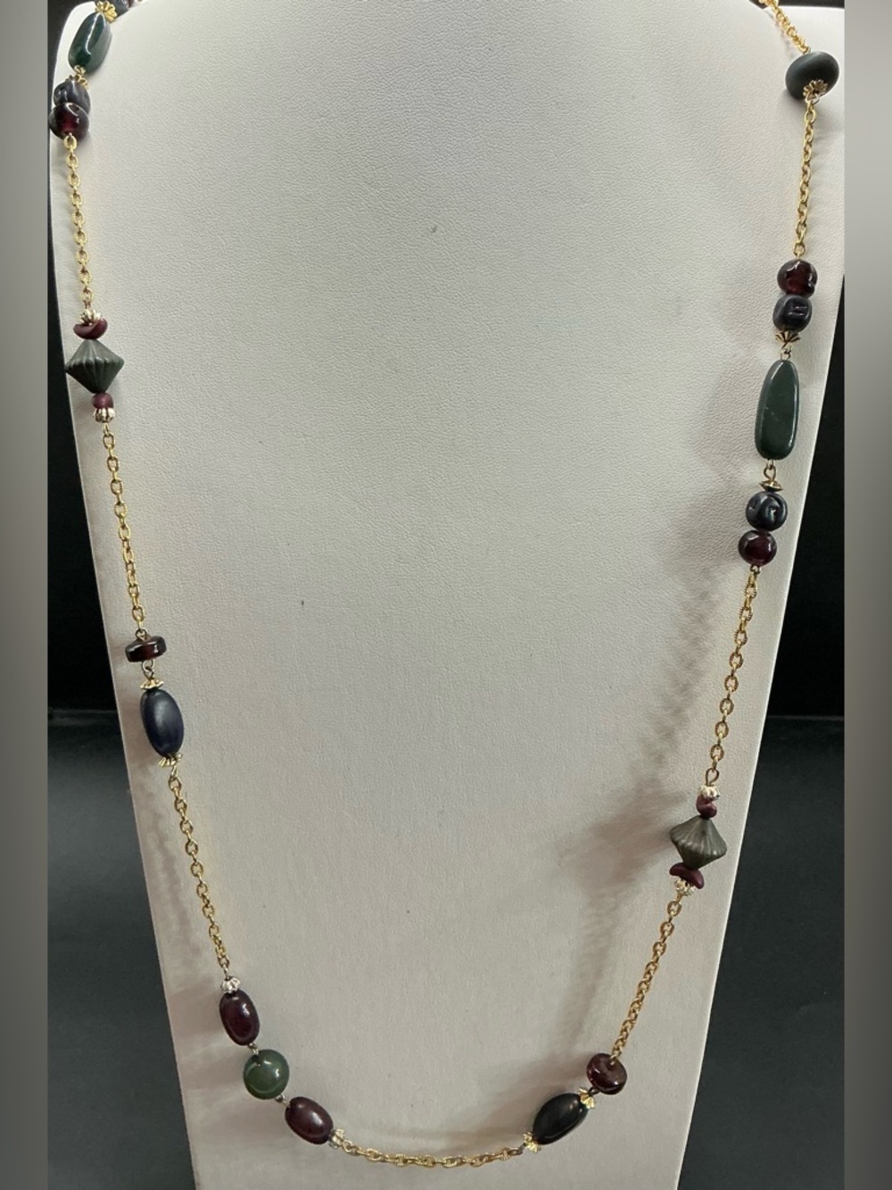 CASUAL CORNER LONG GOLD TONE NECKLACE WITH  DEEP RED AND GREEM BEADED ACCENTS